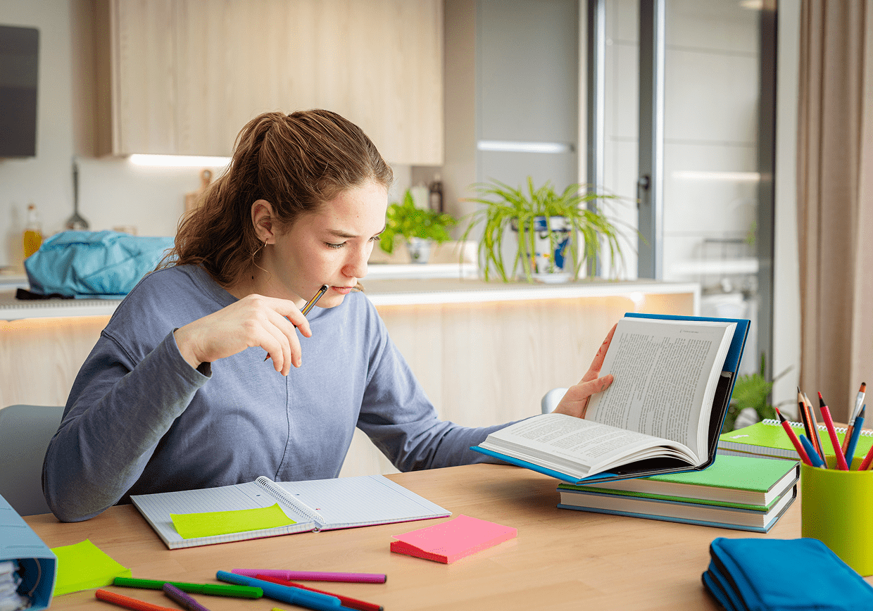 Young woman focused on homework